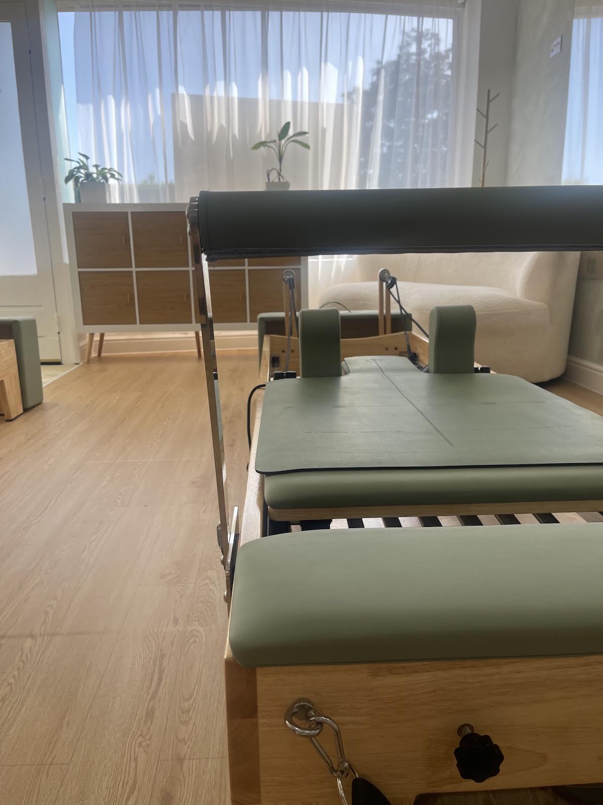 Reformer footbar and carriage in soft morning light
